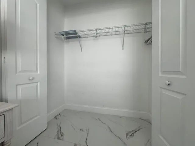 a bathroom with a sink mirror and toilet