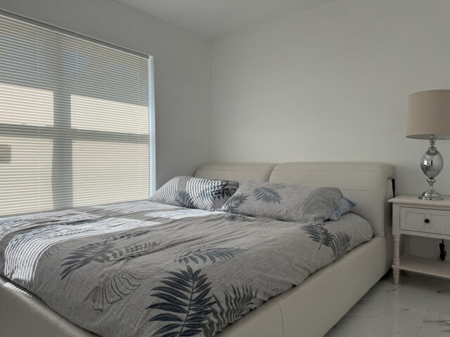 9420 Nickels Boulevard Boynton Beach, FL 33436 - Photo 43 of 57 a bedroom with a bed and window