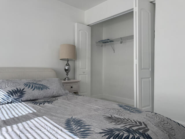 9420 Nickels Boulevard Boynton Beach, FL 33436 - Photo 45 of 57 a bedroom with a bed and a window