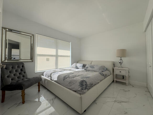 9420 Nickels Boulevard Boynton Beach, FL 33436 - Photo 46 of 57 a bed room with a bed and a couch