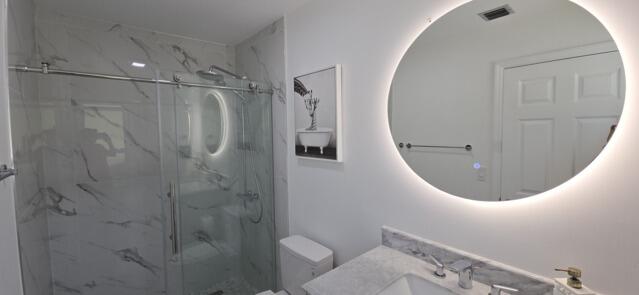 9420 Nickels Boulevard Boynton Beach, FL 33436 - Photo 47 of 57 a bathroom with a sink mirror and toilet