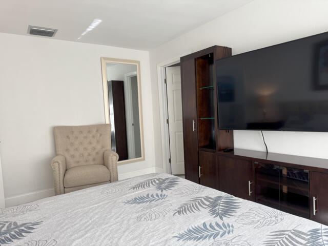 9420 Nickels Boulevard Boynton Beach, FL 33436 - Photo 51 of 57 a bedroom with a bed and a television