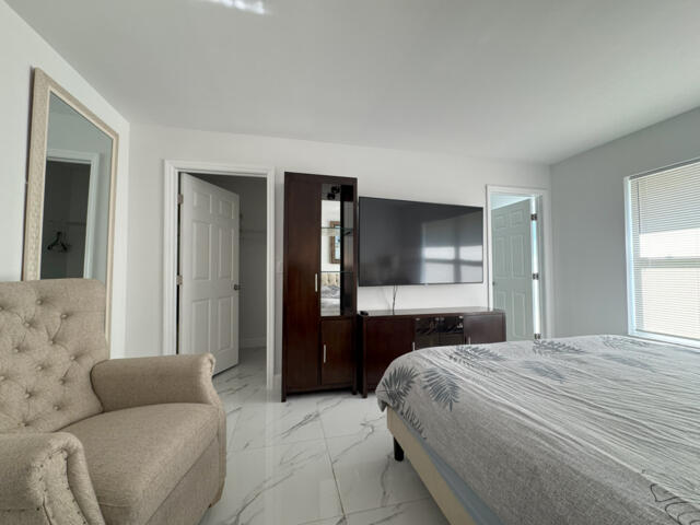 9420 Nickels Boulevard Boynton Beach, FL 33436 - Photo 52 of 57 a bedroom with bed and a couch