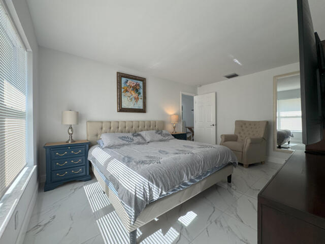 9420 Nickels Boulevard Boynton Beach, FL 33436 - Photo 55 of 57 a bedroom with bed and window