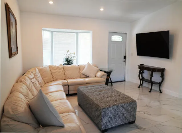 a living room with furniture and a window