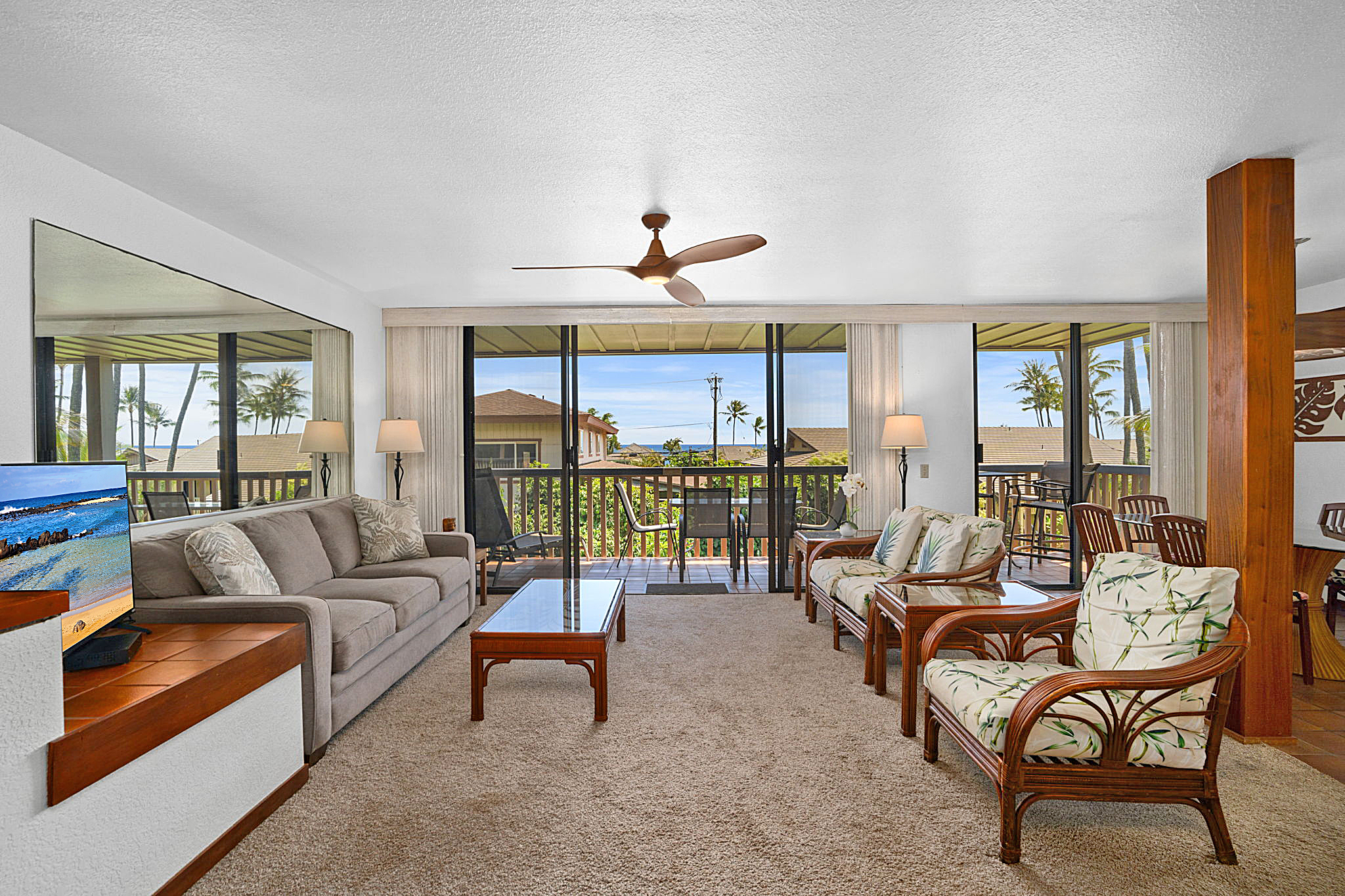 1870 Hoone Road, Unit 511 Koloa, HI 96756 - Photo 3 of 26 a living room with furniture and a large window