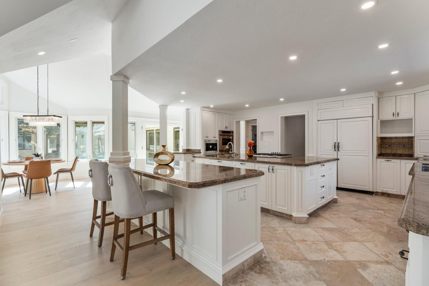 1080 Finley Road Pleasanton, CA 94588 - Photo 37 of 85 a kitchen with appliances a sink a counter top space and a center island