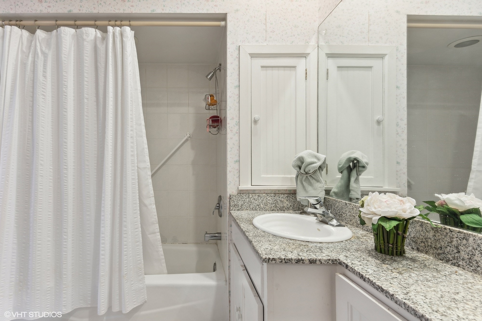 664 Lincoln Avenue Winnetka, IL 60093 - Photo 16 of 26 a bathroom with a granite countertop sink and a mirror