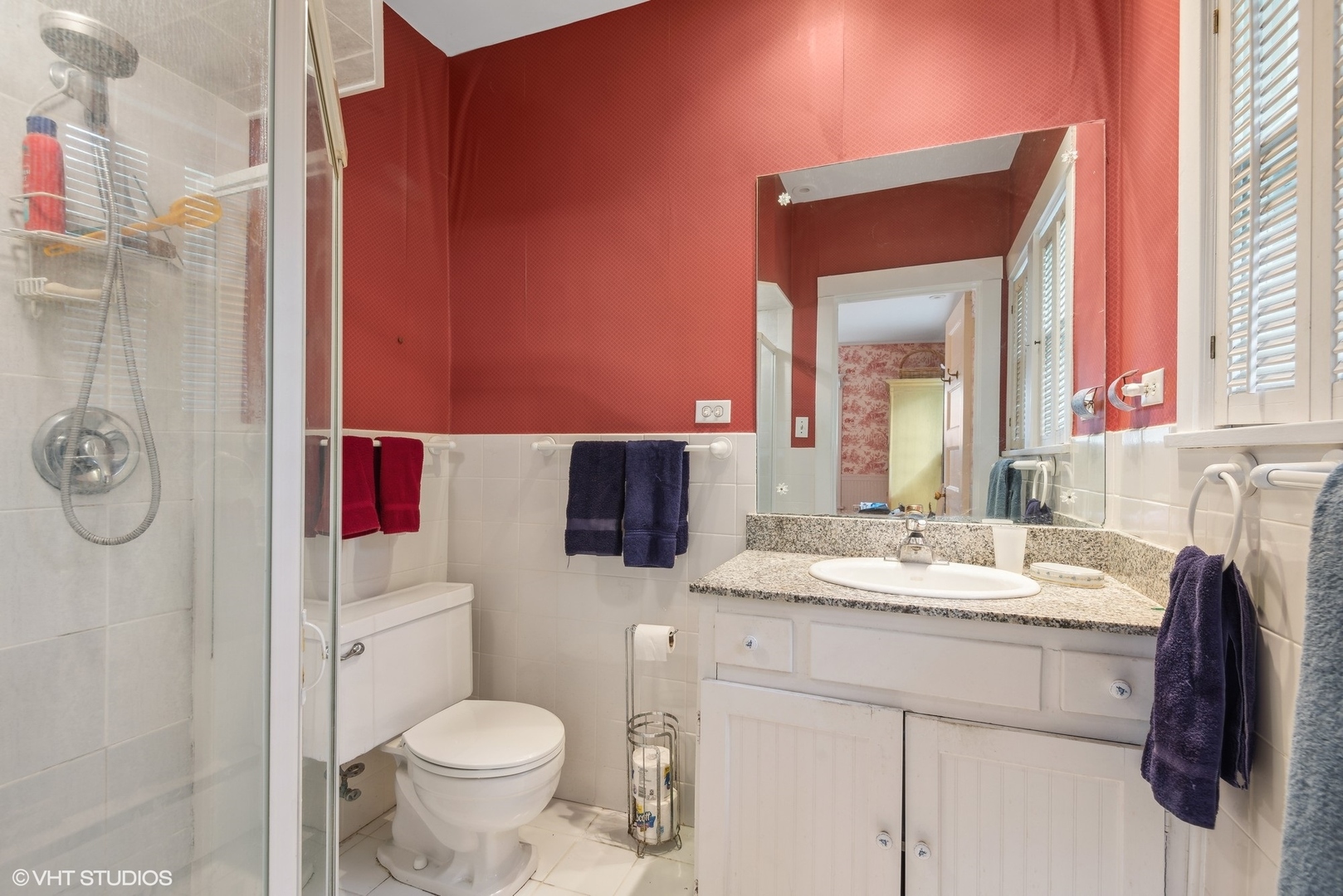 664 Lincoln Avenue Winnetka, IL 60093 - Photo 18 of 26 a bathroom with a granite countertop toilet sink and mirror