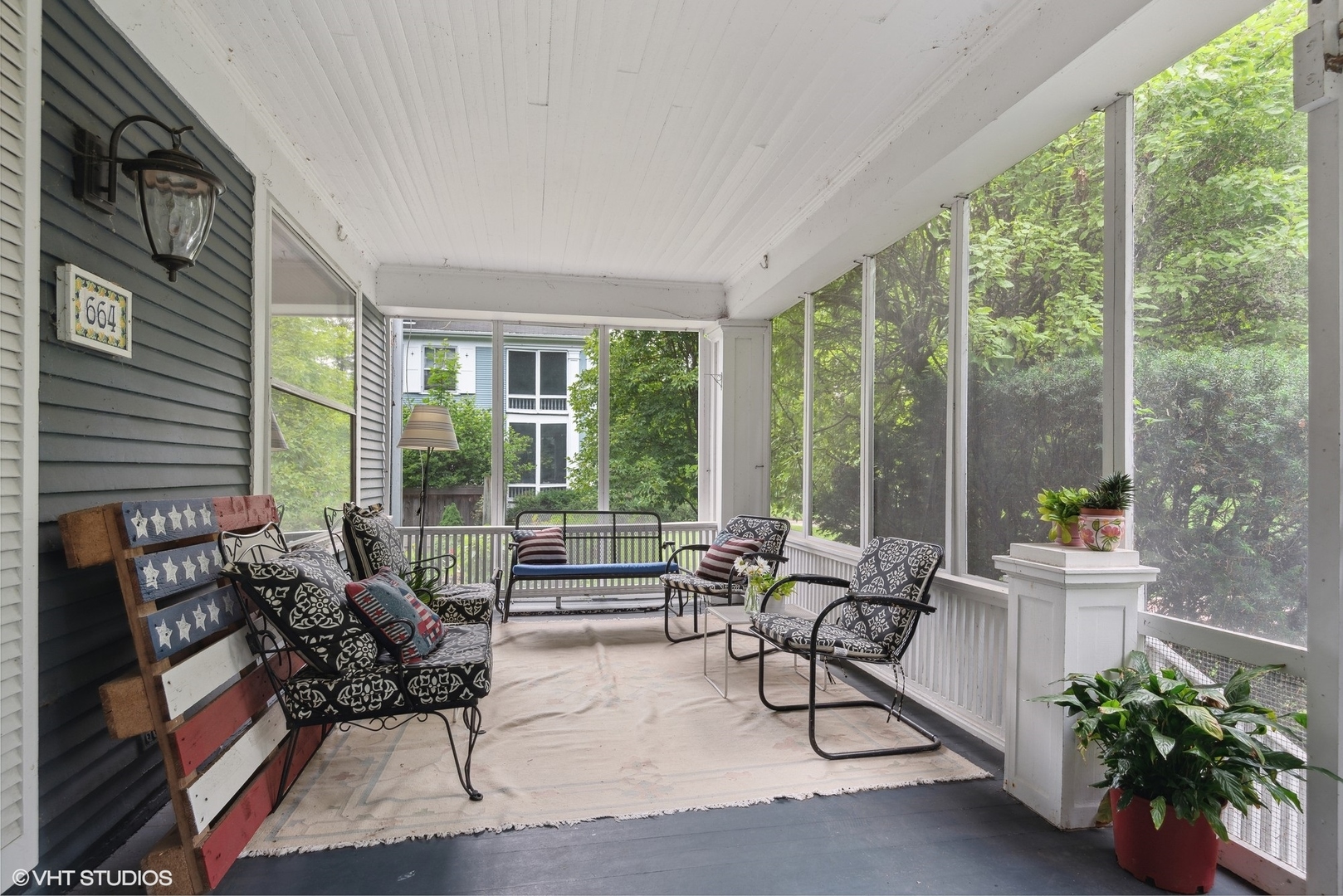664 Lincoln Avenue Winnetka, IL 60093 - Photo 25 of 26 a living room with furniture and floor to ceiling windows