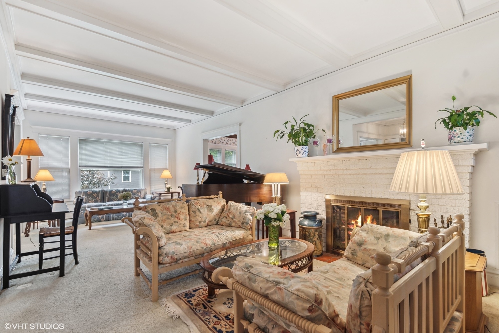 664 Lincoln Avenue Winnetka, IL 60093 - Photo 4 of 26 a living room with furniture and a fireplace