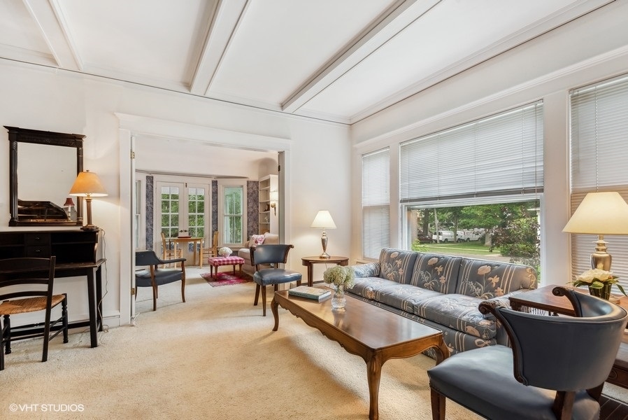 664 Lincoln Avenue Winnetka, IL 60093 - Photo 7 of 26 a living room with furniture and a large window
