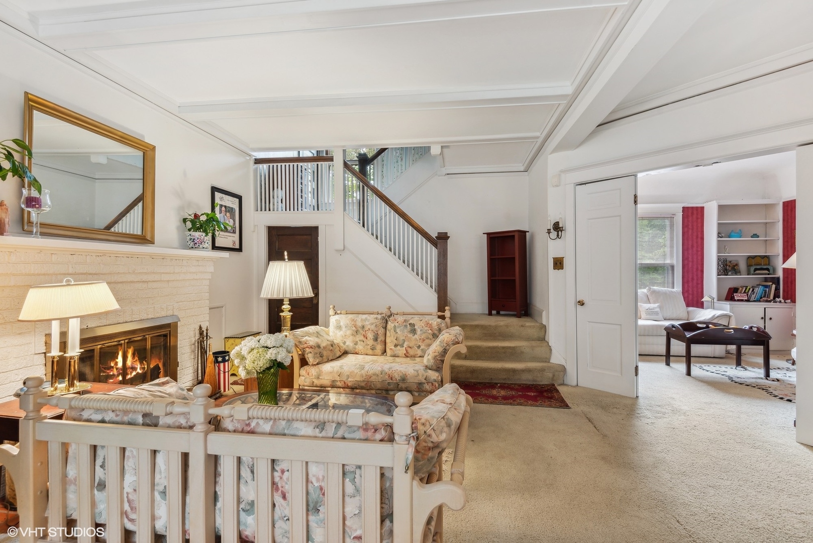 664 Lincoln Avenue Winnetka, IL 60093 - Photo 9 of 26 a living room with furniture and a fireplace