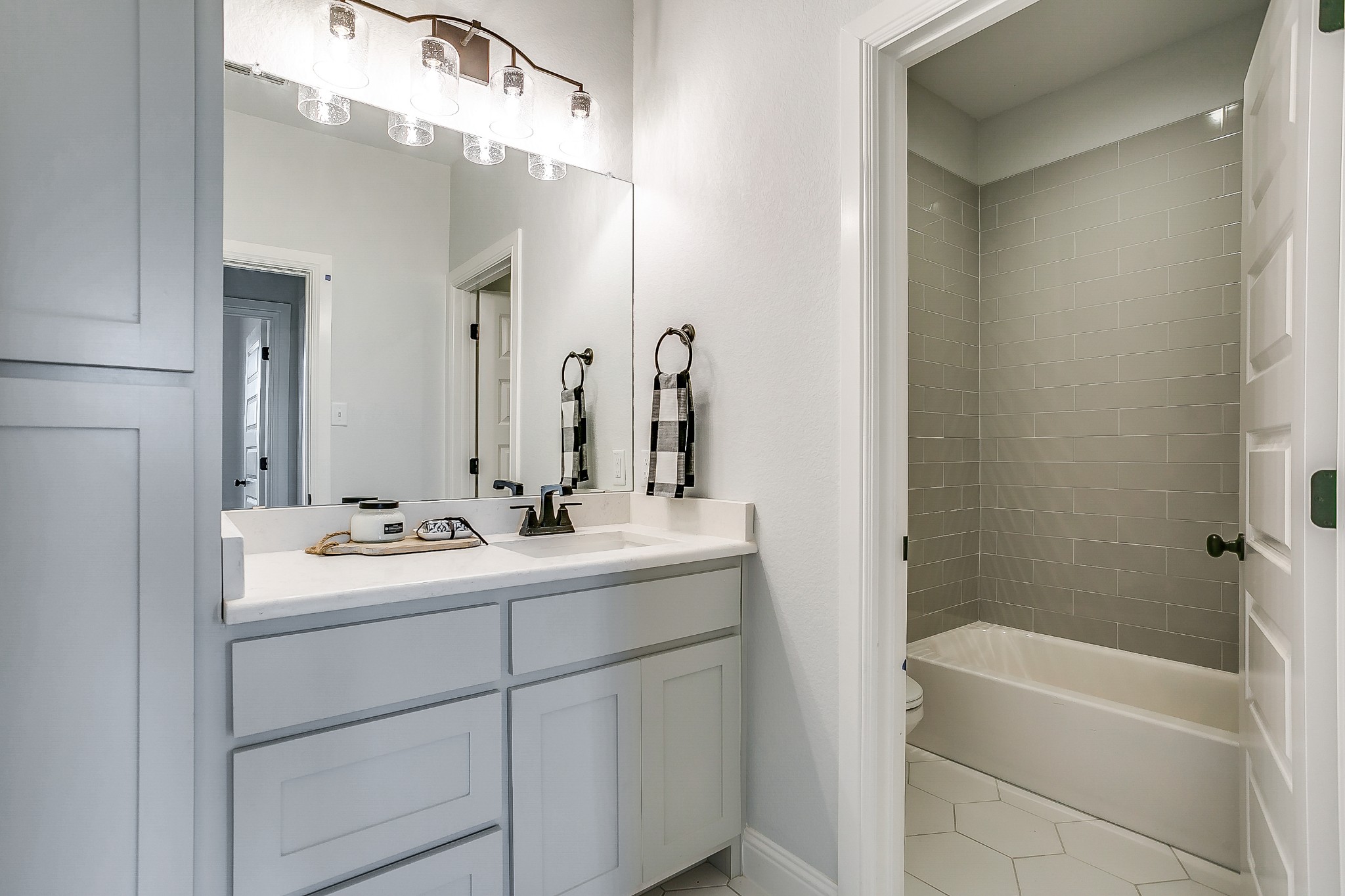 1526 Columbia Road Charlotte, TN 37036 - Photo 9 of 17 a bathroom with a bathtub a sink and a mirror