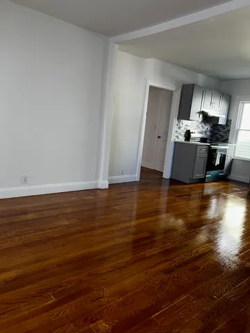 a view of a kitchen with microwave and cabinets