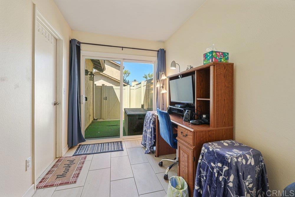 10385 Seth Way Santee, CA 92071 - Photo 20 of 33 a bedroom with a bed and a flat tv screen