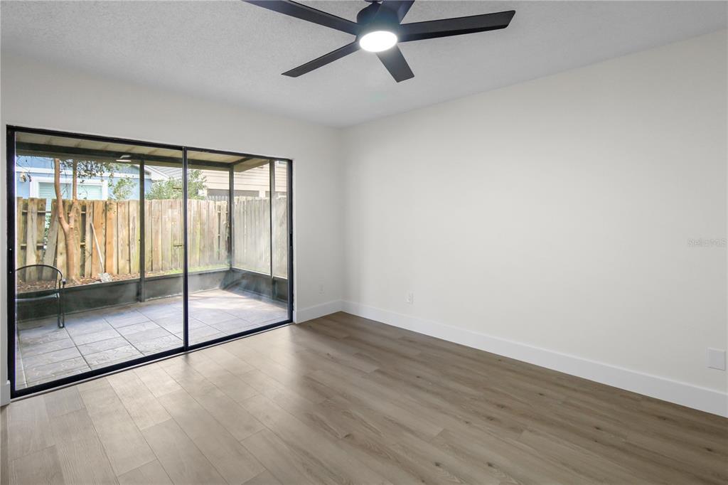 1888 Springbush Lane Clearwater, FL 33763 - Photo 12 of 31 wooden floor in an empty room with a window