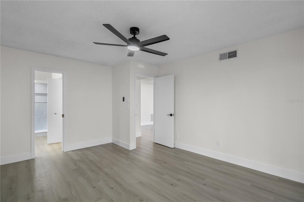 1888 Springbush Lane Clearwater, FL 33763 - Photo 14 of 31 a view of a big room with wooden floor and windows
