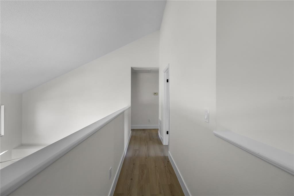 1888 Springbush Lane Clearwater, FL 33763 - Photo 17 of 31 a view of a hallway with wooden floor