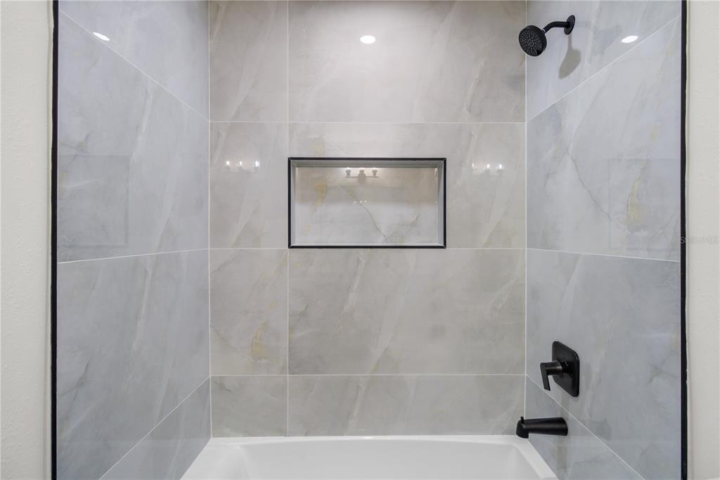 1888 Springbush Lane Clearwater, FL 33763 - Photo 22 of 31 a bathroom with a shower