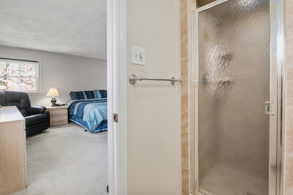 6 Dudley Road Lexington, MA 02421 - Photo 20 of 37 a bedroom with a bed couch and a window