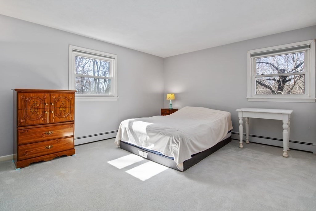 6 Dudley Road Lexington, MA 02421 - Photo 24 of 37 a bedroom with a bed and a window