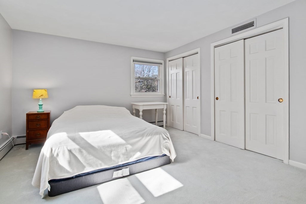 6 Dudley Road Lexington, MA 02421 - Photo 25 of 37 a bed sitting in a bedroom and closet