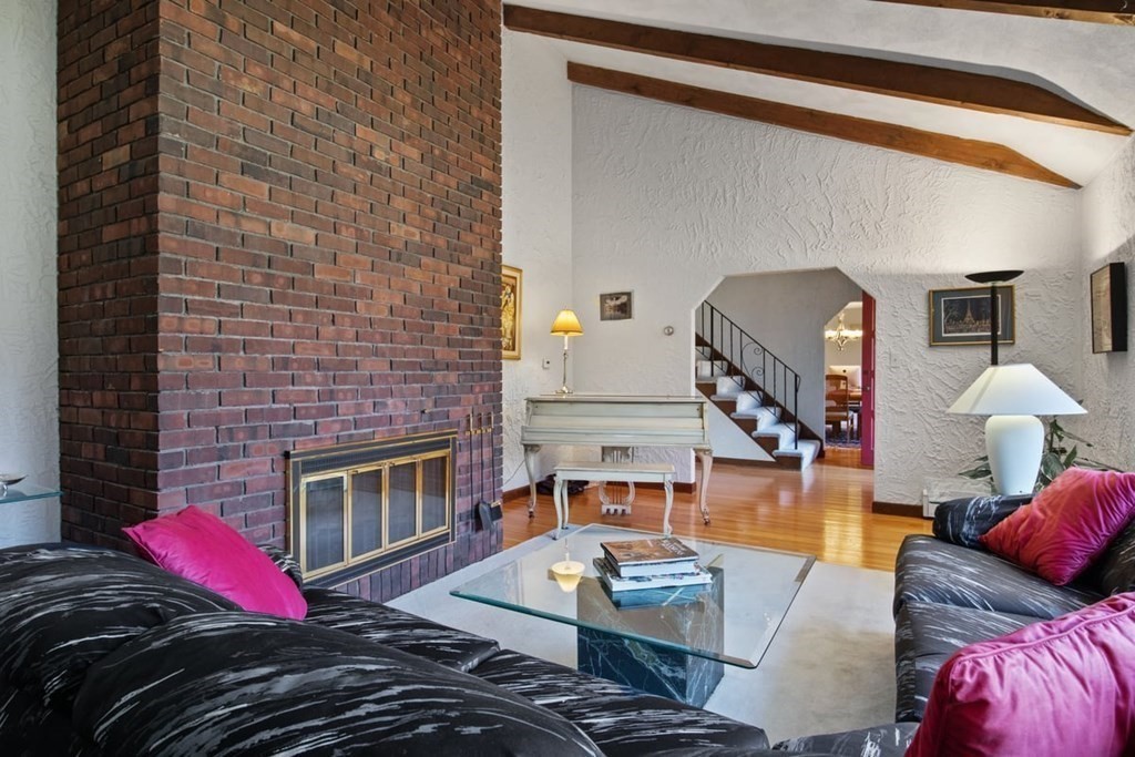 6 Dudley Road Lexington, MA 02421 - Photo 6 of 37 a living room with furniture and a fireplace