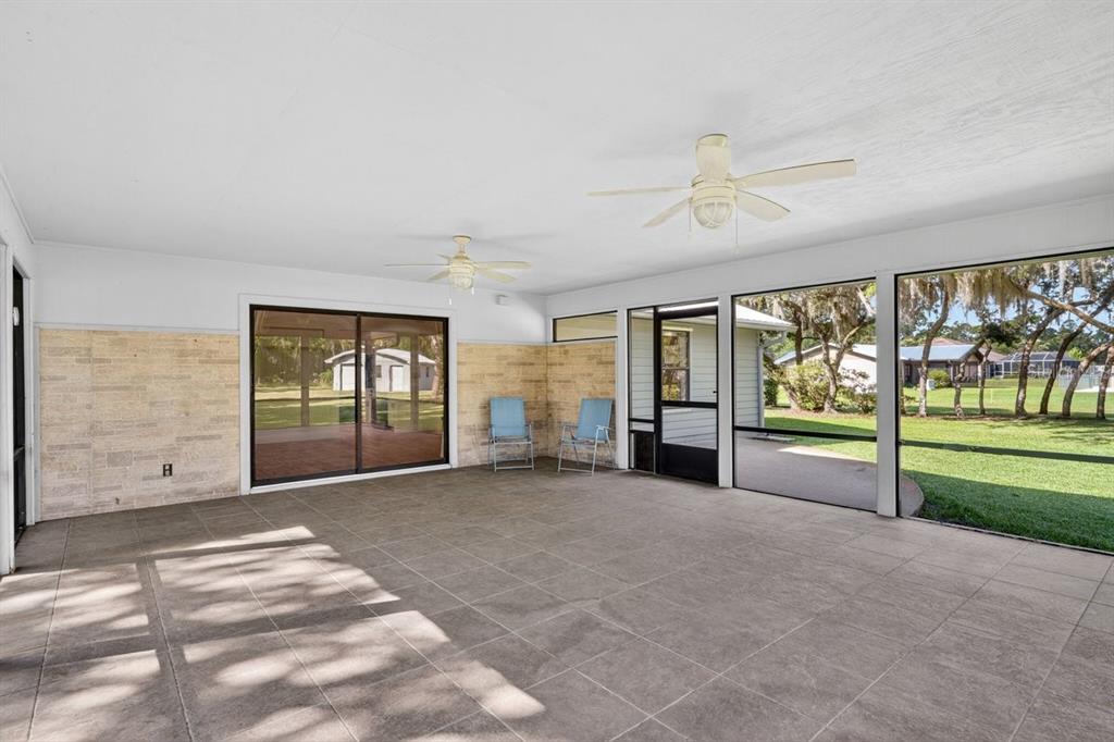 171 William Street Edgewater, FL 32141 - Photo 24 of 40 a view of an empty room with a fireplace and a window
