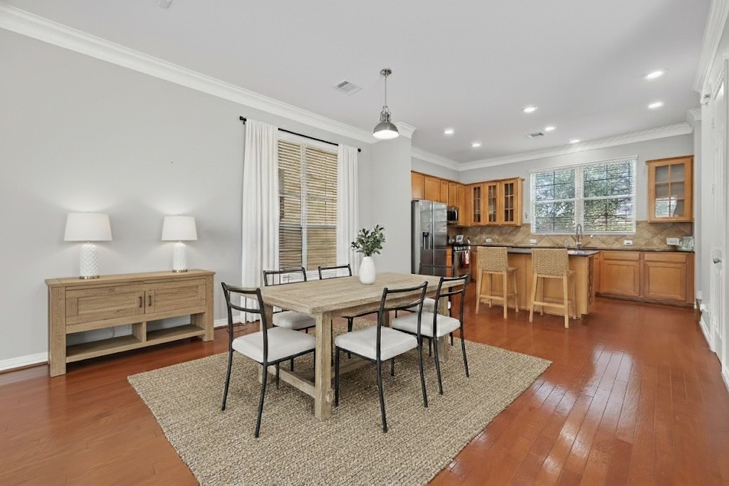 3019 Clearview Circle Houston, TX 77025 - Photo 12 of 42 a dining room with furniture and wooden floor