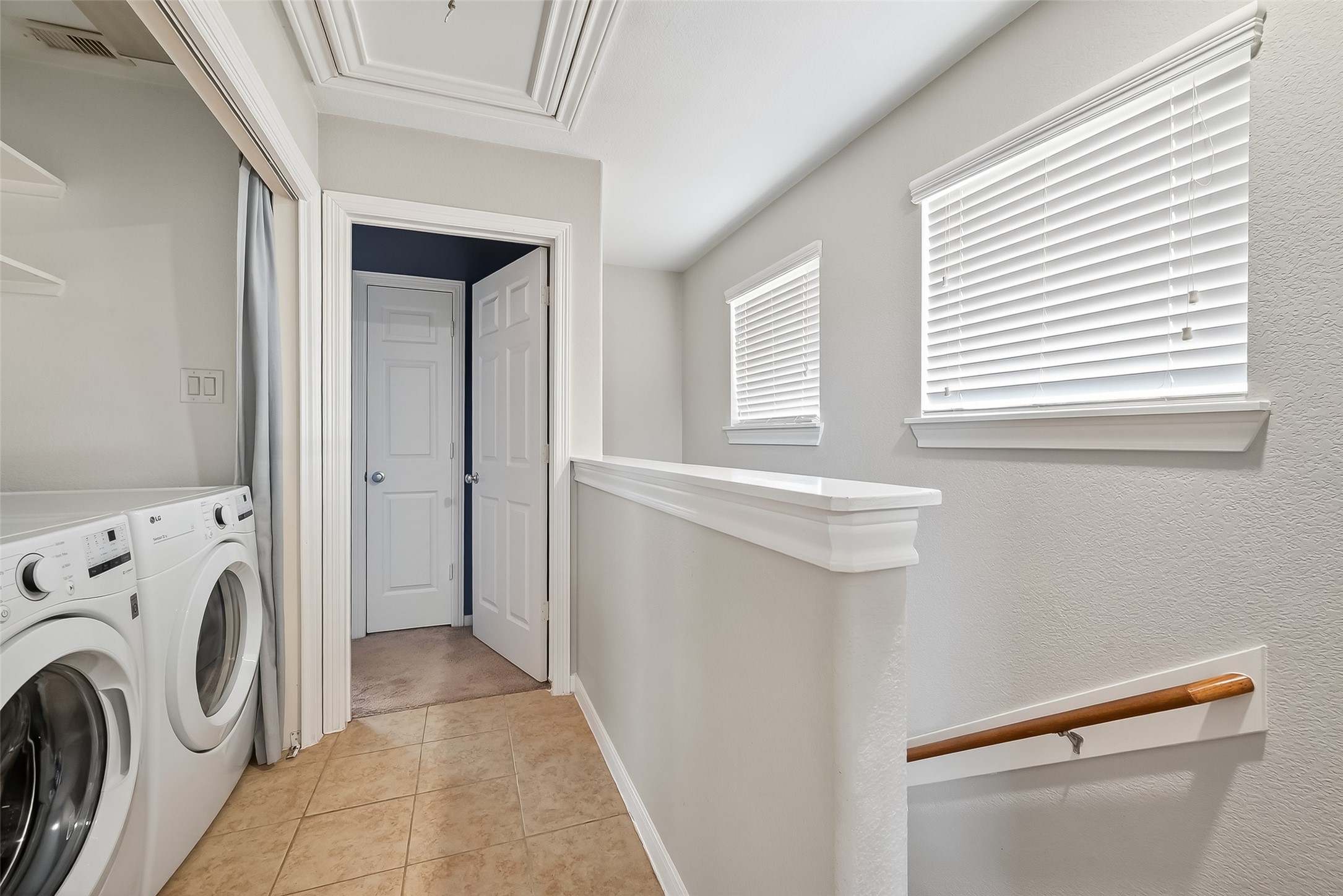 3019 Clearview Circle Houston, TX 77025 - Photo 22 of 42 a view of a hallway with washer and dryer