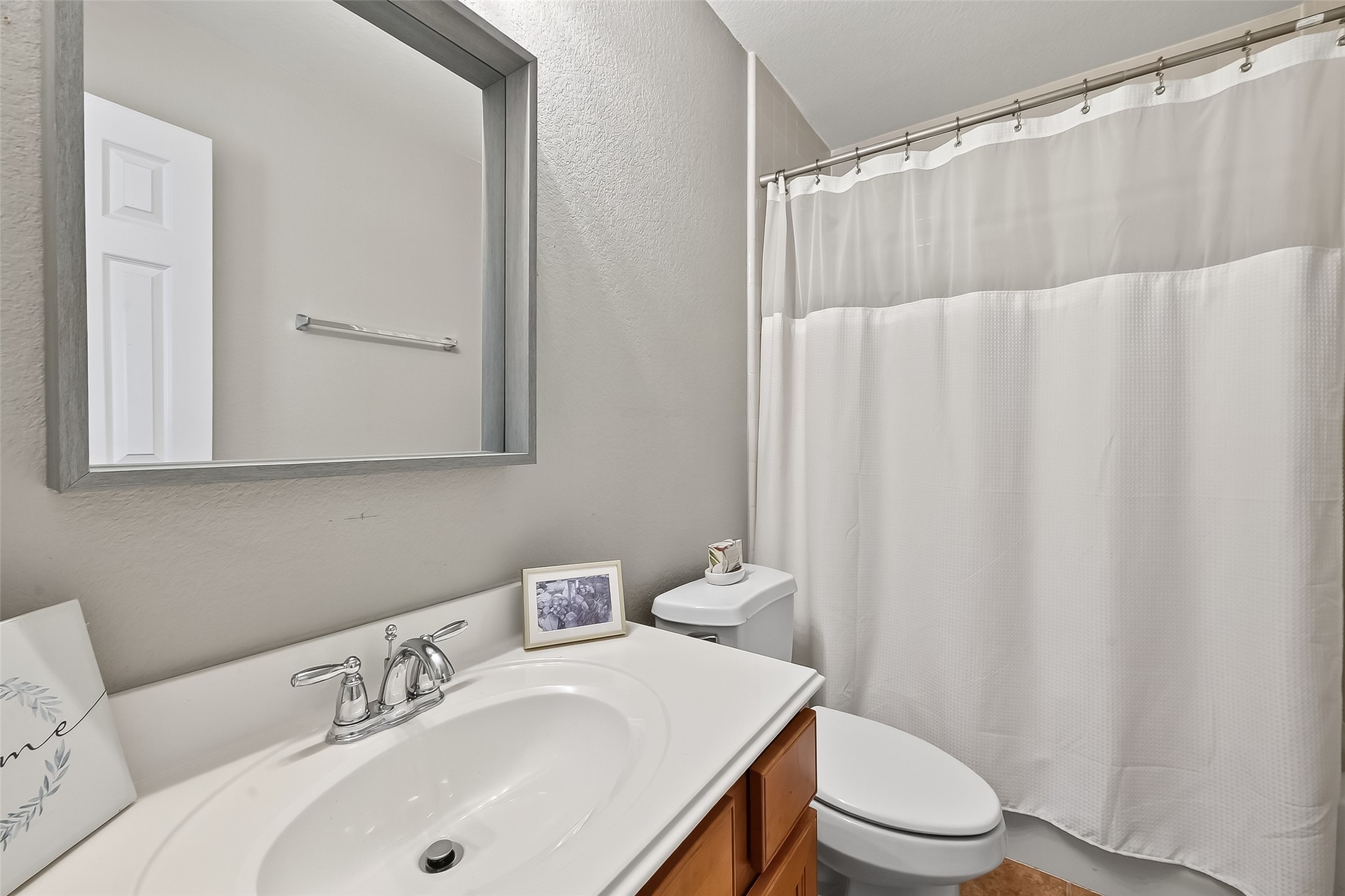 3019 Clearview Circle Houston, TX 77025 - Photo 27 of 42 a bathroom with a sink a toilet and shower