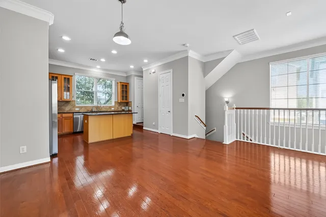 a view of a kitchen with a sink and a window