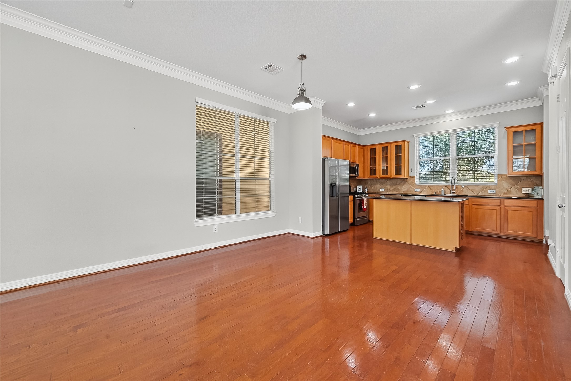 3019 Clearview Circle Houston, TX 77025 - Photo 9 of 42 a view of a kitchen with a sink stove cabinets and empty room