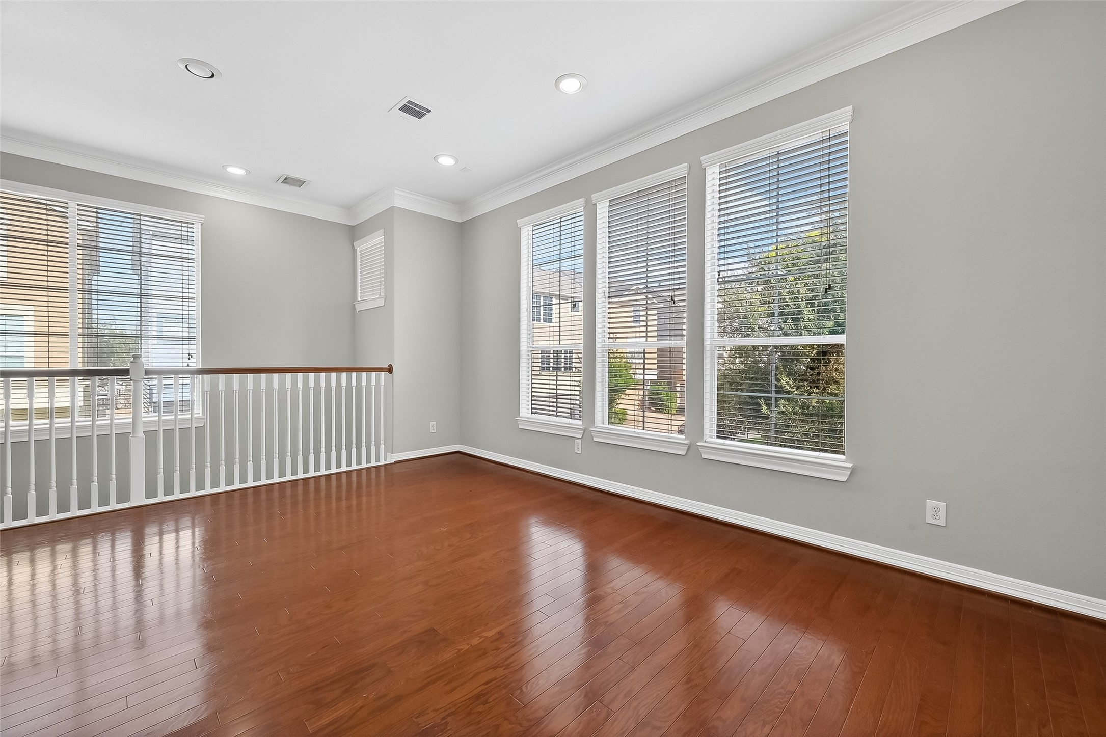 3019 Clearview Circle Houston, TX 77025 - Photo 10 of 42 a view of an empty room with wooden floor and a window