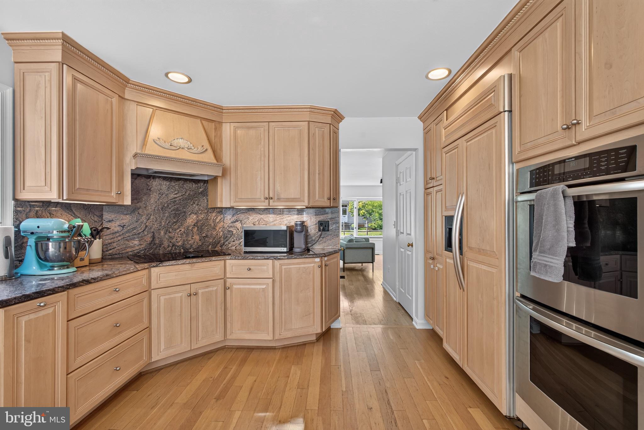 108 Spot Club Road Arnold, MD 21012 - Photo 5 of 30 Elegant kitchen with warm wood tones.