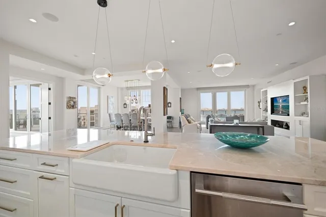 a spacious bedroom with a bed and a flat screen tv