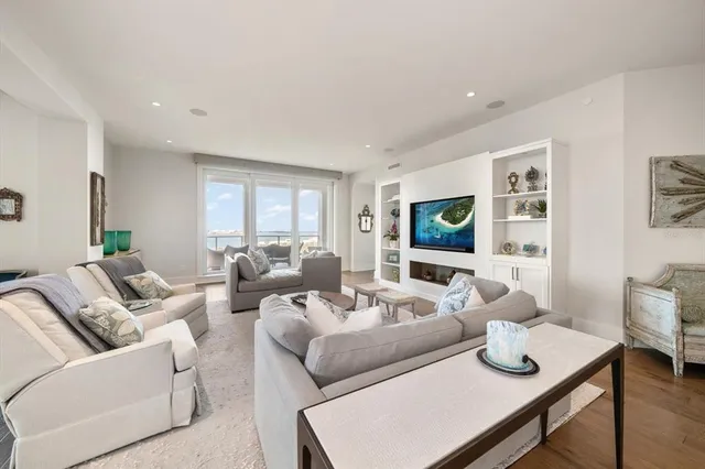 a spacious bathroom with a double vanity sink a mirror and a bathtub