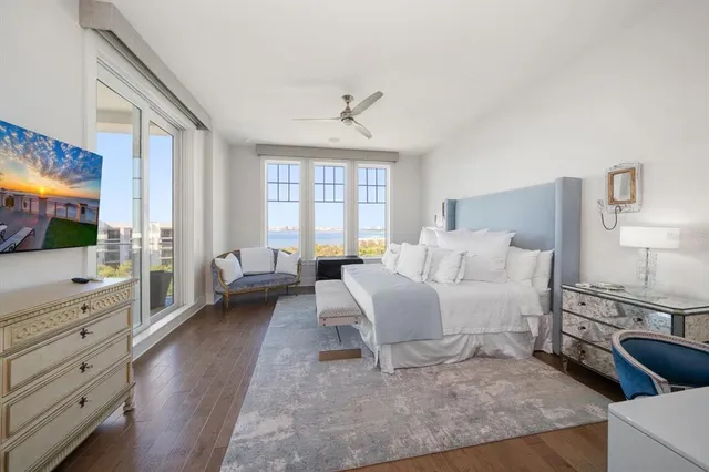 a roof deck with outdoor seating and city view