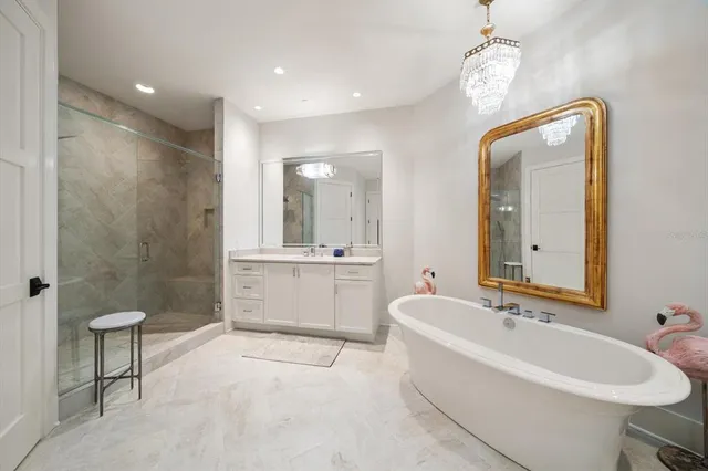 a living room with furniture wooden floor and a flat screen tv