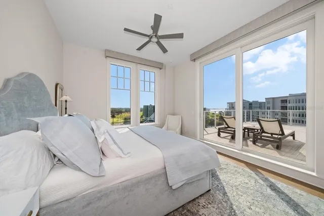 a view of a living room and a balcony