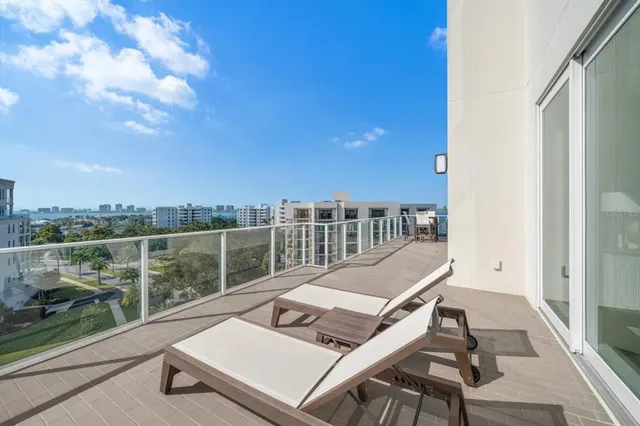 a living room with furniture fireplace and rug