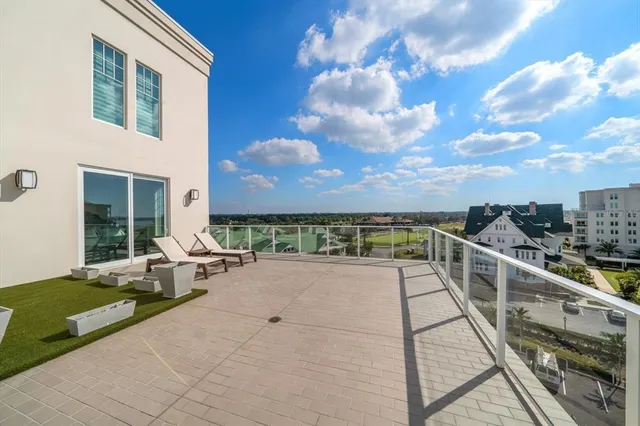 an aerial view of a houses with a yard