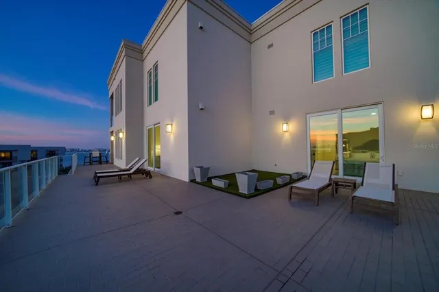 a kitchen with kitchen island a counter top space and stainless steel appliances