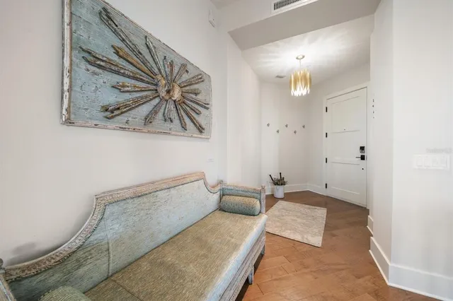 a view of a dining room with furniture large windows and wooden floor