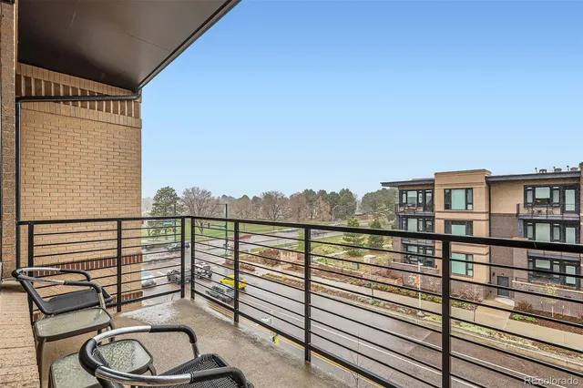 a view of a balcony with chairs
