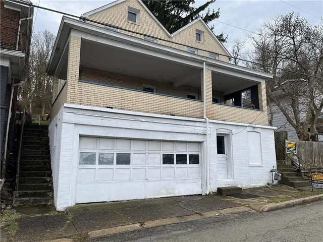 a view of a house with a garage