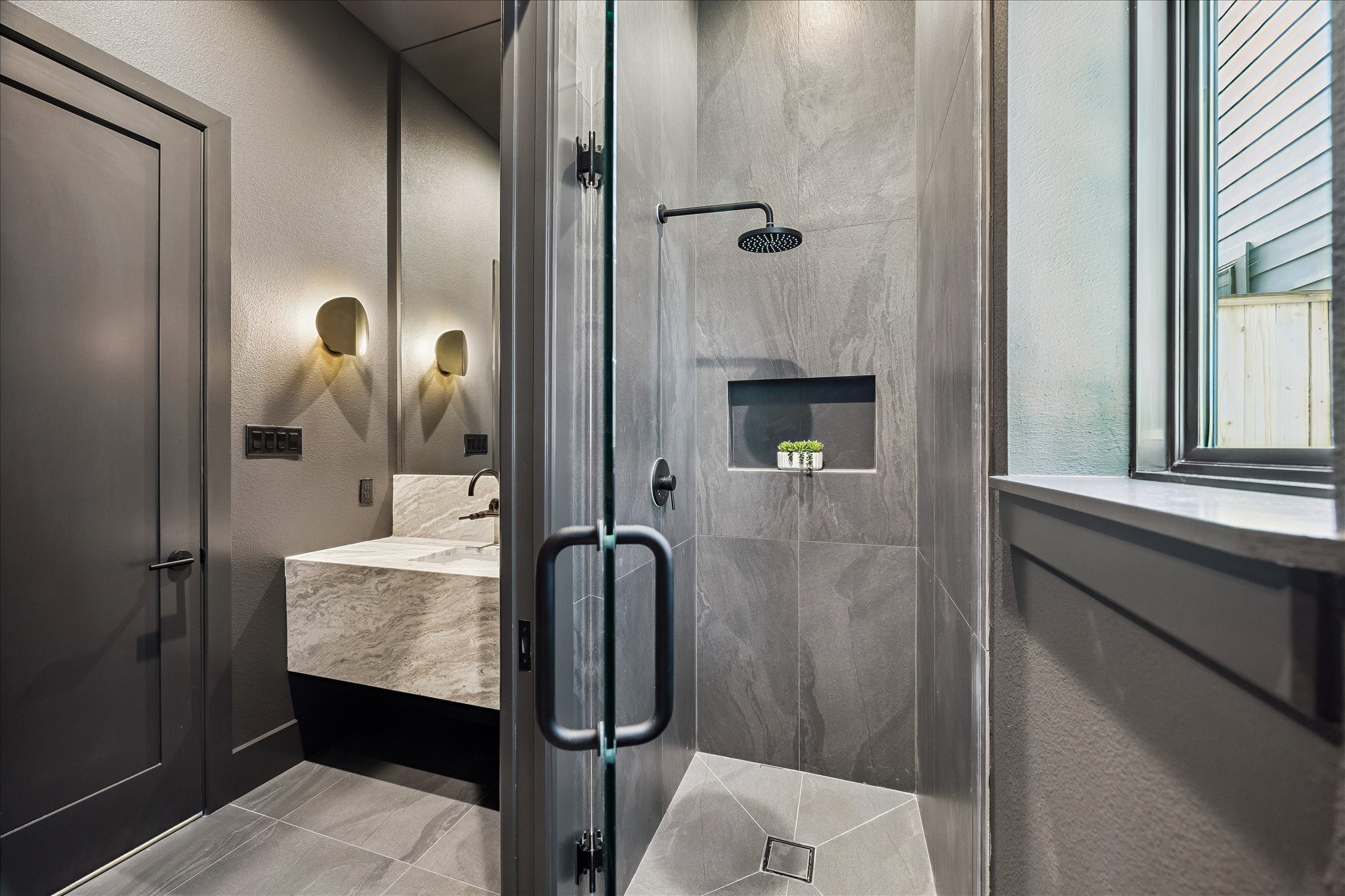 335 Harvard Street Houston, TX 77007 - Photo 14 of 35 Walk-in shower with frameless glass doors.