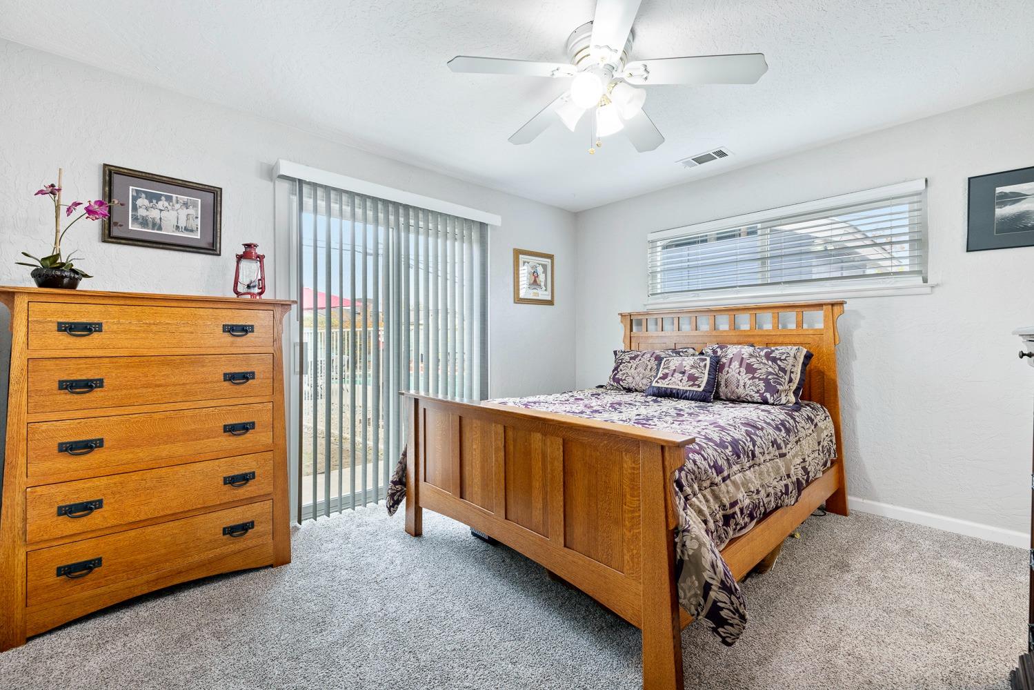 2637 Dewitt Avenue Clovis, CA 93612 - Photo 14 of 25 a bed room with a bed and a dresser