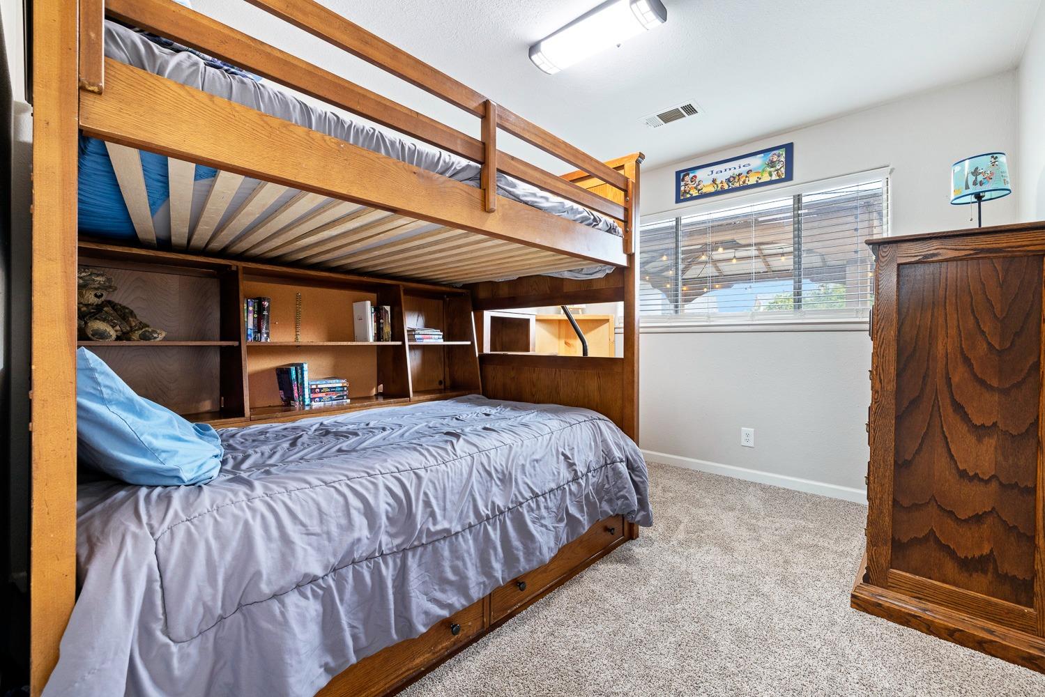 2637 Dewitt Avenue Clovis, CA 93612 - Photo 16 of 25 a bedroom with a bed and a window